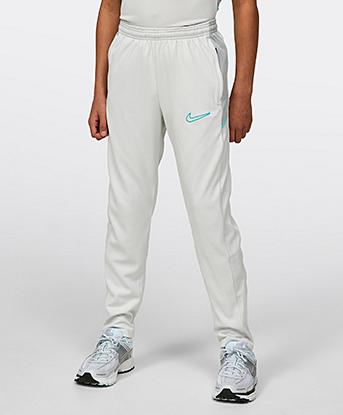 Nike Junior Academy Pant in Photon Dust / Light Smoke Grey