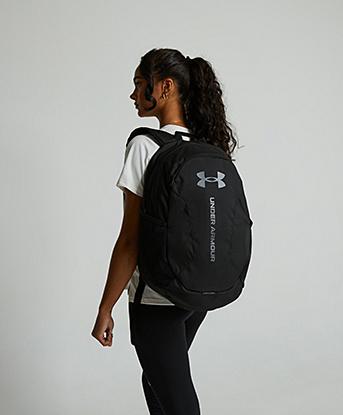 Under Armour Hustle Lite Backpack in Black / Castlerock