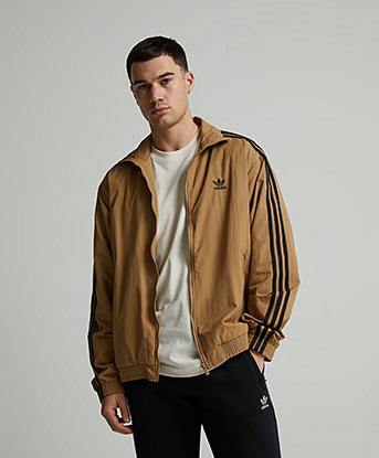 adidas Originals Woven Firebird Track Top in Cardboard / Black