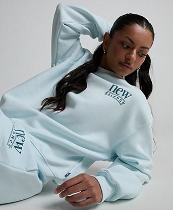 New Balance Womens Reimagined Fleece Crew Sweatshirt in Glint Blue