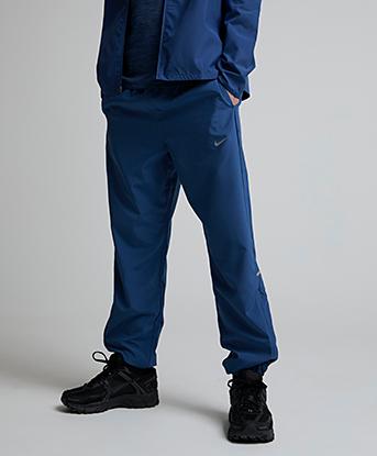 Nike Junior Miler Woven Pant in Mystic Navy / Reflective Silver