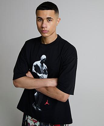 Jordan Statement Graphic Short Sleeved T-Shirt in Black / Infrared 23