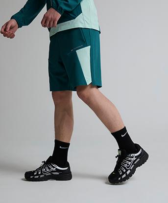 Monterrain Junior Deflect Woven Short in Seafarer Teal / Stream Green