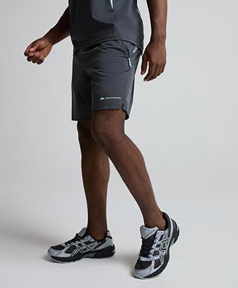 Monterrain Stride Woven Short in Urban Charcoal / Steam Green