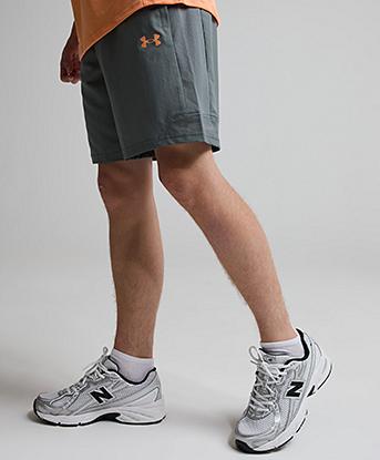 Under Armour Junior UA Tech Utility Woven Short in Clay Green / Orange Bloc