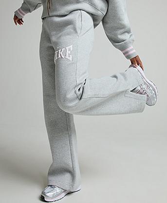 Nike Womens Phoenix Fleece Open Hem Pant in Light Smoke Grey / Pink Foam