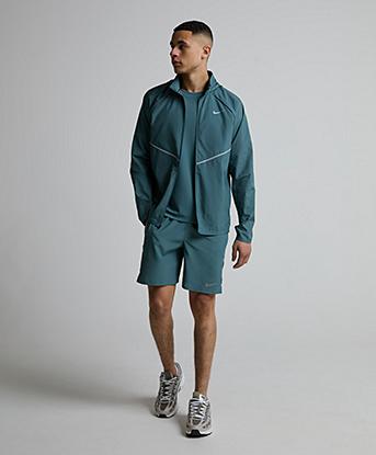 Nike Dri-FIT Miler 7 Inch Unlined Short in Mineral Slate / Black Spruce / Reflective Silver