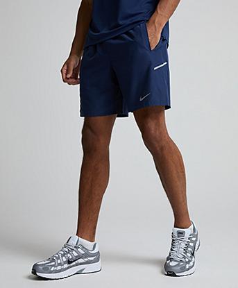 Nike Dri-FIT Miler 7 Inch Unlined Short in Midnight Navy / Obsidian / Reflective Silver