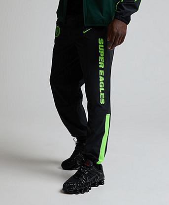 Nike Nigeria Energy Dri-FIT Football Woven Pant in Black / Pro Green