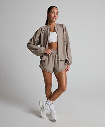 Asics Womens Nagino Run Adjustable Jacket in Greige