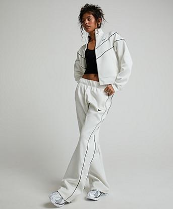 Nike Womens Windrunner Mid-Rise Slim Knit Pant in Sail / Black / Black