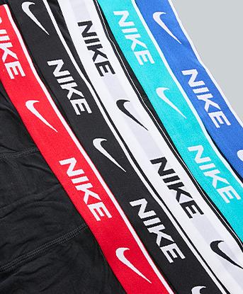 Nike 5 Pack Cotton Trunk in Black / Dusty Cactus / Game Royal / White