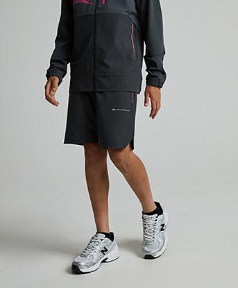 Monterrain Junior Abyss Woven Running Short in Urban Charcoal / Forged Steel / Neon Fuschia