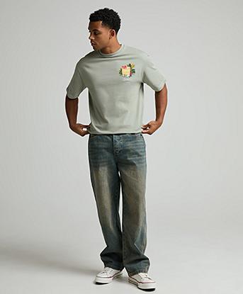 Celebre Loose Fit Denim Jean in Mid Blue Wash / Brown Tint