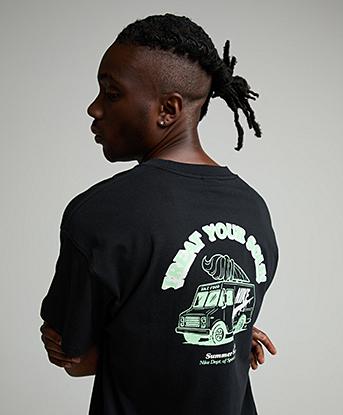 Nike Treat Your Sole T-Shirt in Black / Illusion Green